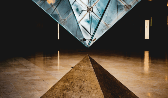 Egyptian pyramid with glass futuristic pyramid